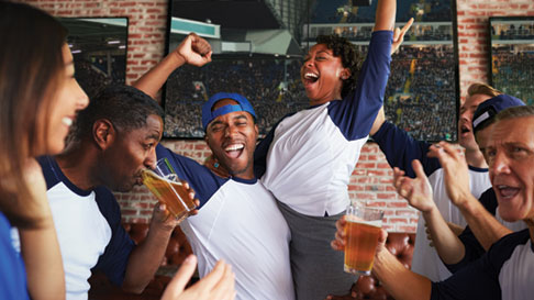 group of people jumping and cheering
